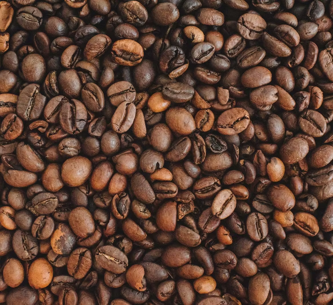 Roasted coffee beans filling the frame in close-up