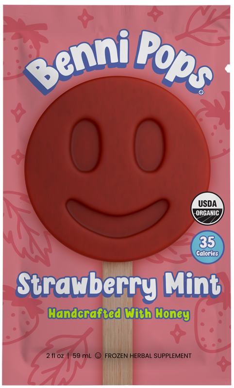 Benni Pops Strawberry Mint frozen popsicle in compostable packaging, featuring a deep red smiley-face pop made with organic strawberries, mint, and honey