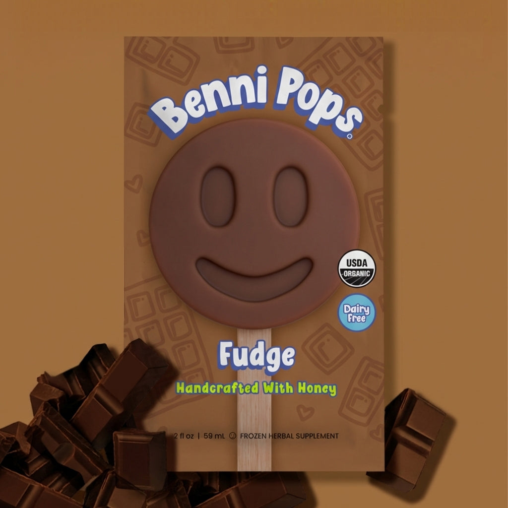 Benni Pops Orange Vanilla frozen dessert in compostable packaging, featuring a smiley-face treat handcrafted with honey, fresh orange slices, and real vanilla, dairy-free and USDA organic