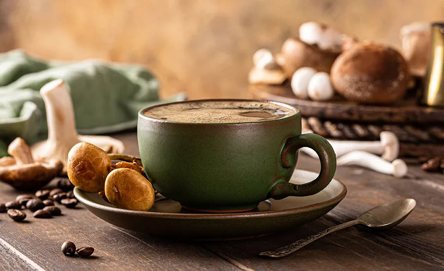 Warm beverage in a ceramic mug surrounded by mushrooms and natural elements, styled in a cozy, rustic setting